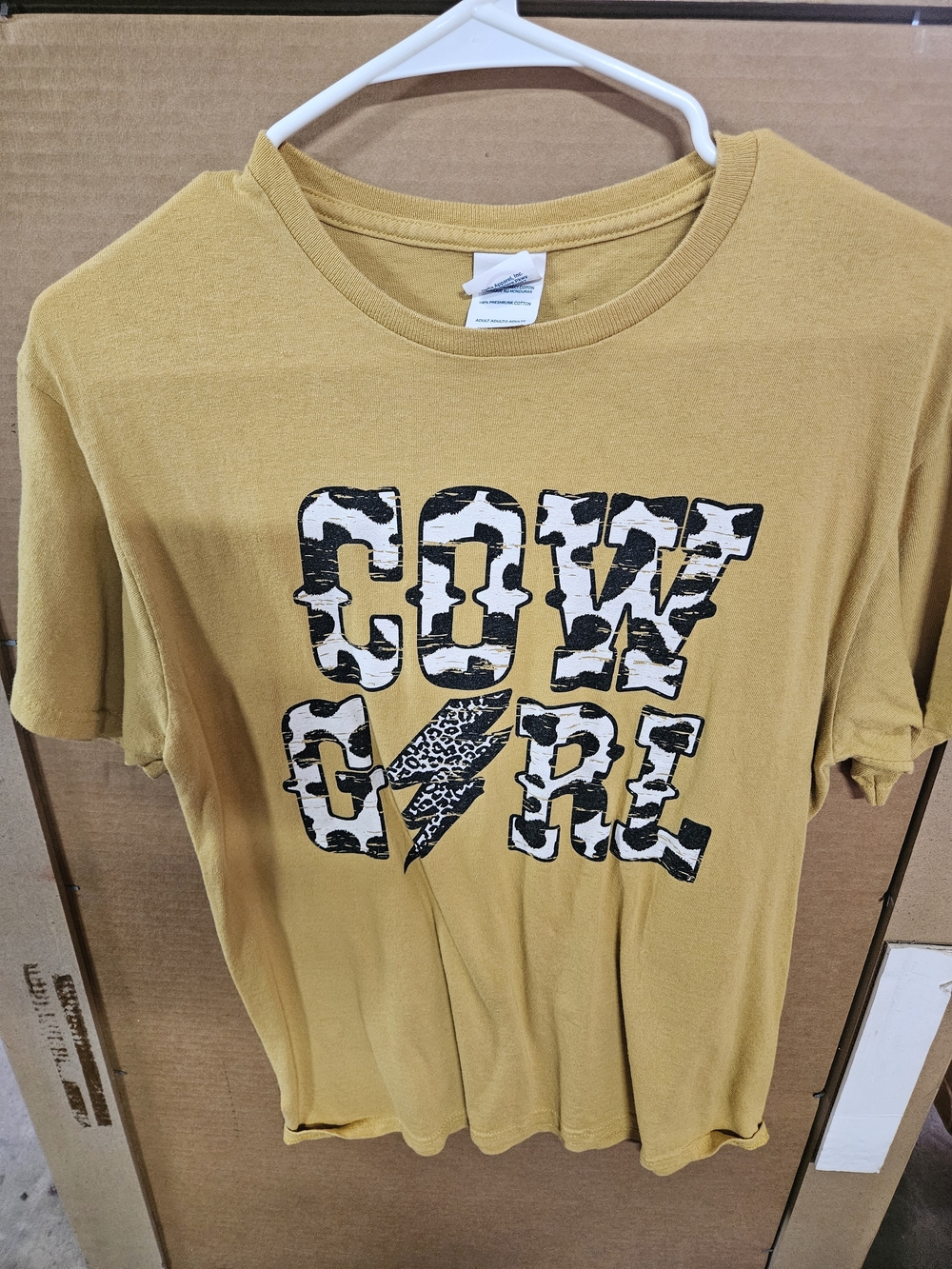Mustard Graphic Tee with Black & White Cow Print Text